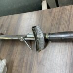 Early torque wrench designs including beam and click type mechanisms