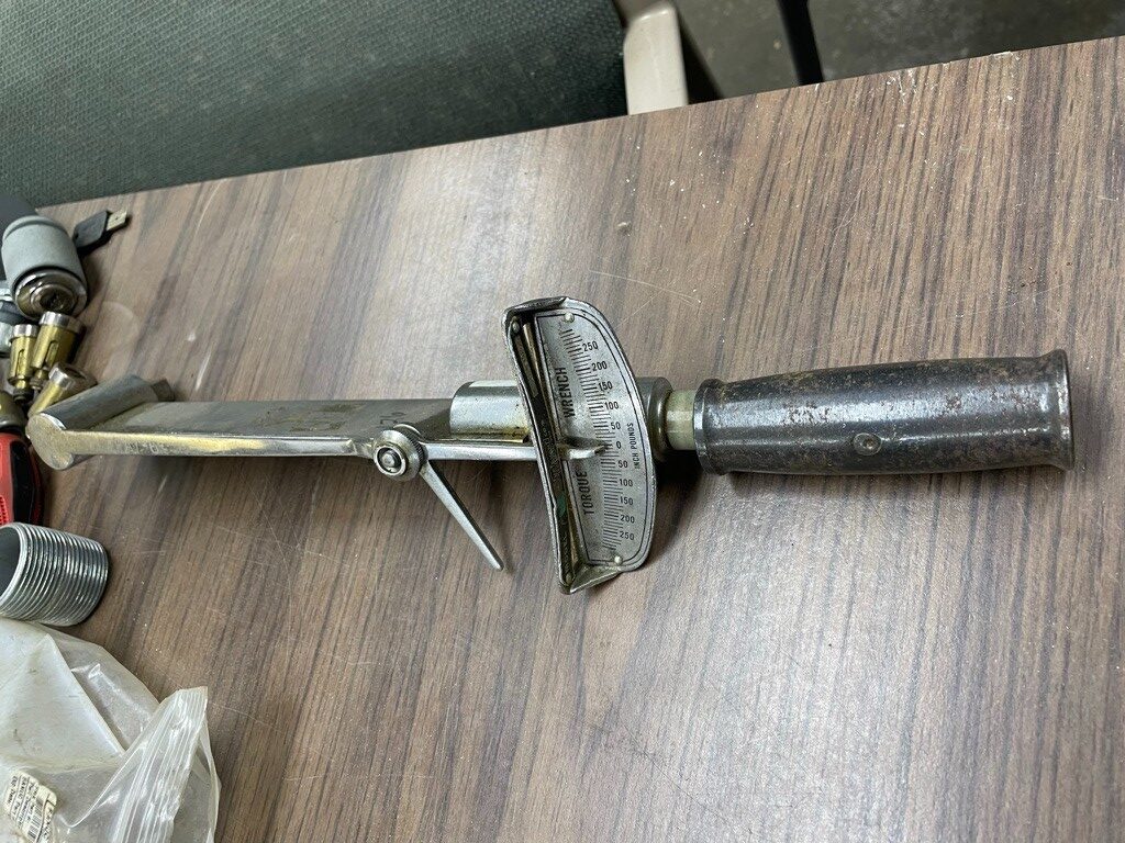 Early torque wrench designs including beam and click type mechanisms